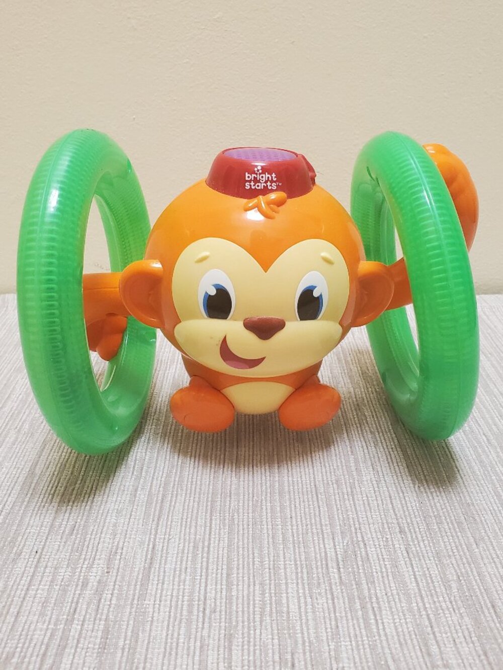 Bright Starts Roll & Glow Monkey baby/toddler music toy